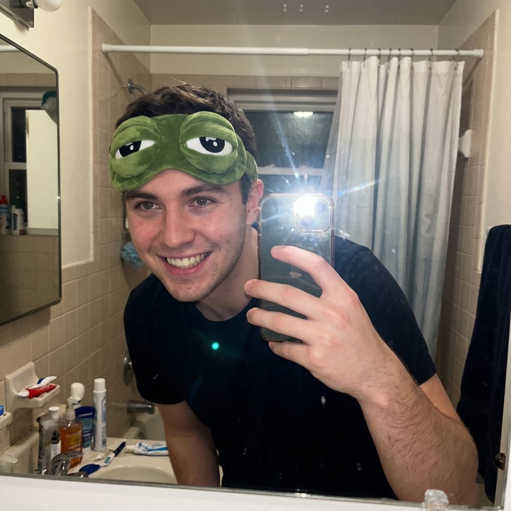 Person showing off a Snugsy Frog Mask