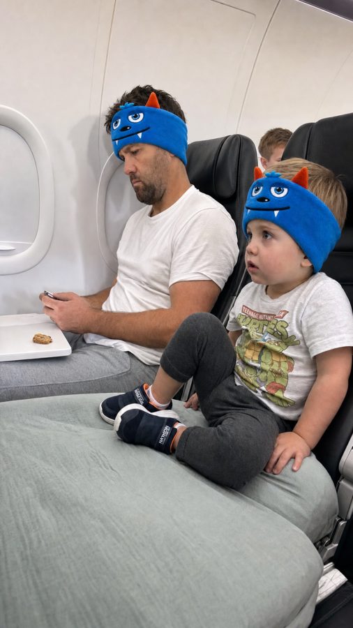 Dad and toddler in Snugsy Buds on a plane